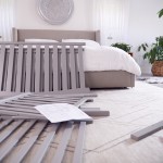 Instructions And Components For Self Assembly Baby Cot On Bedroom Floor